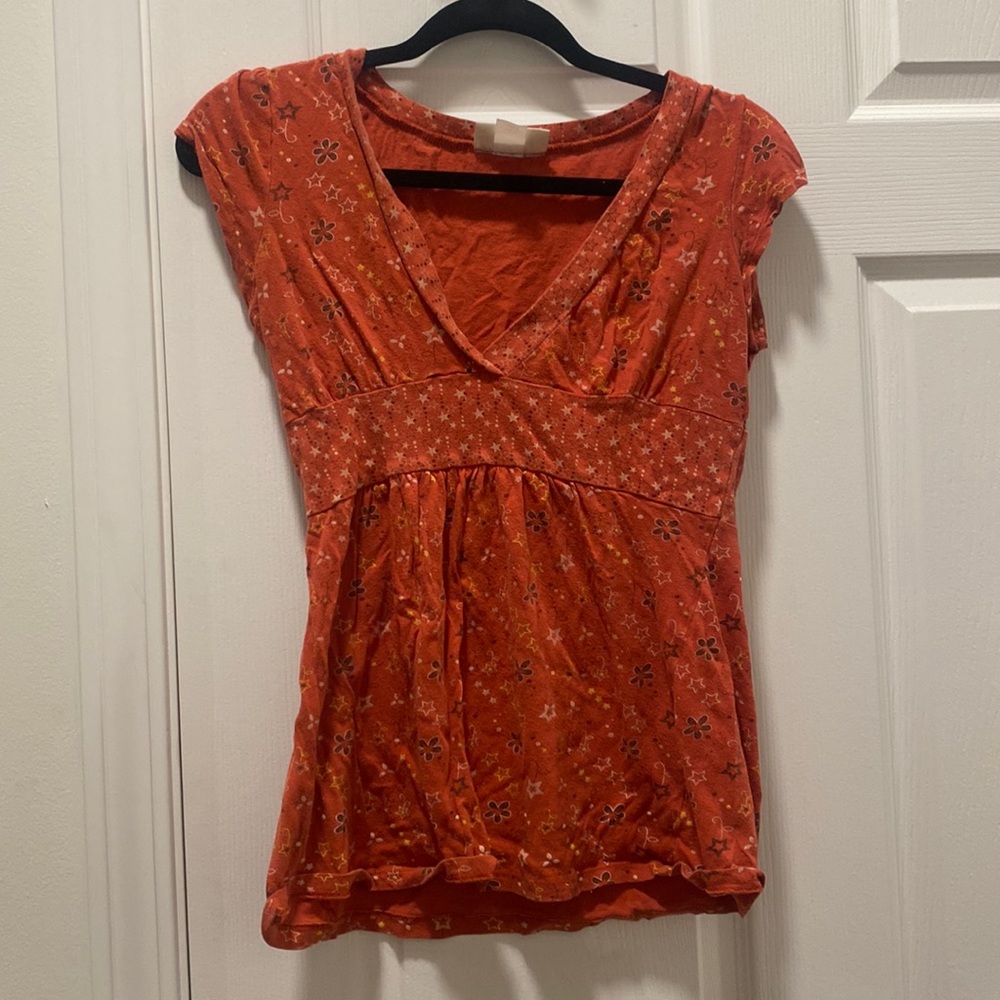Juniors orange floral and stars top
